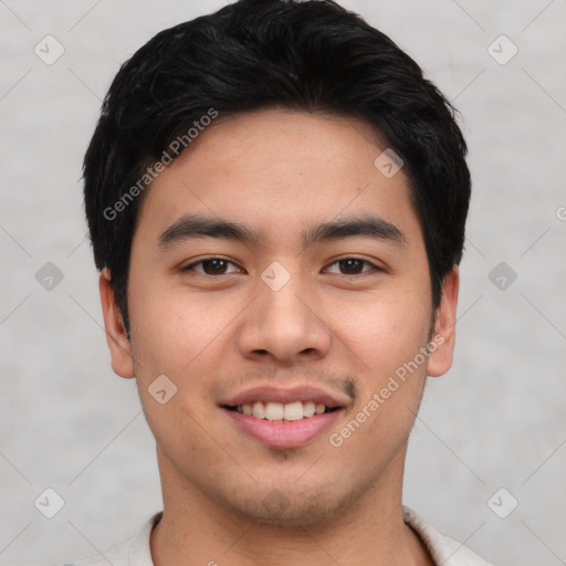 Joyful asian young-adult male with short  brown hair and brown eyes