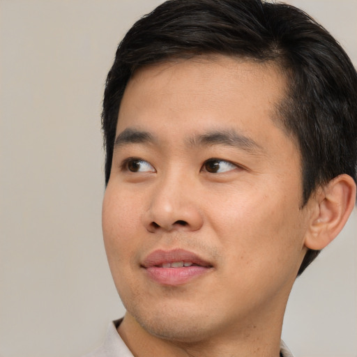 Neutral asian young-adult male with short  black hair and brown eyes