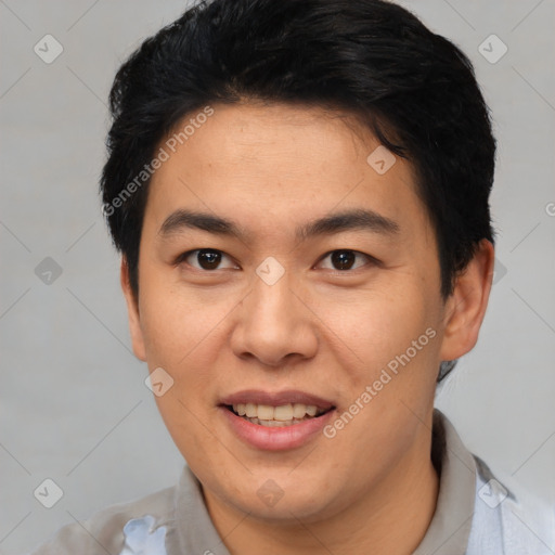 Joyful asian young-adult male with short  brown hair and brown eyes