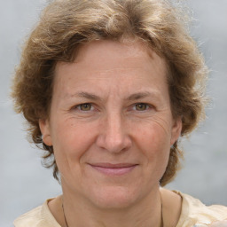 Joyful white adult female with short  brown hair and grey eyes