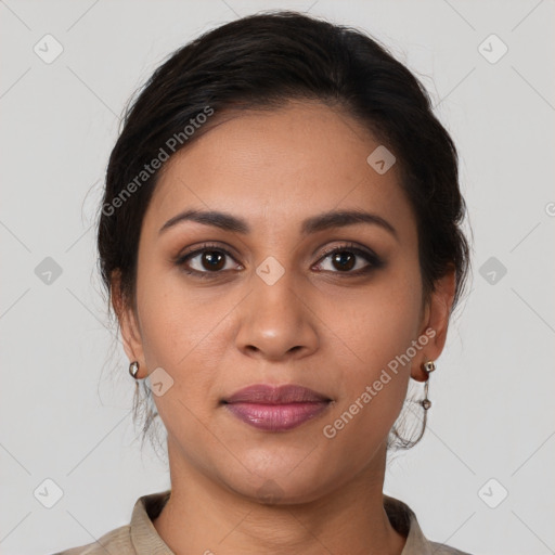 Joyful latino young-adult female with medium  brown hair and brown eyes