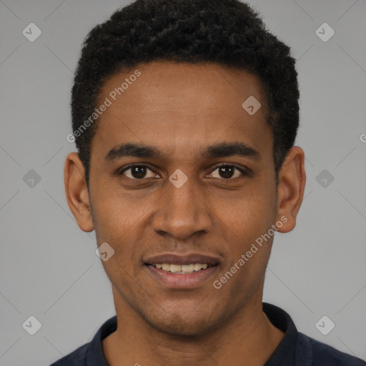 Joyful black young-adult male with short  black hair and brown eyes