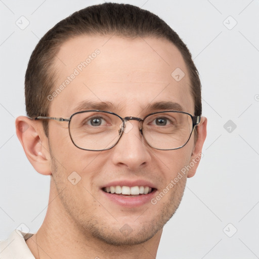 Joyful white adult male with short  brown hair and grey eyes