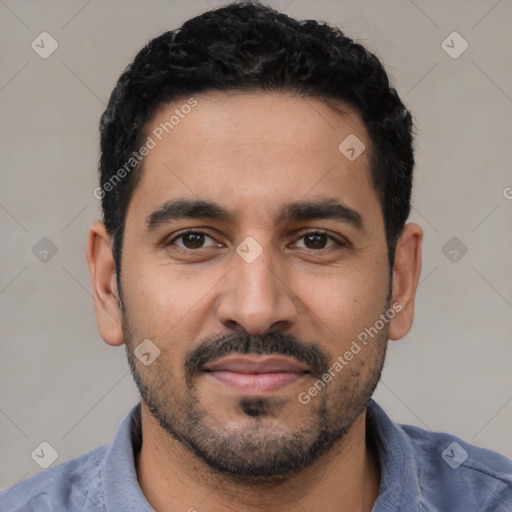 Joyful latino young-adult male with short  black hair and brown eyes