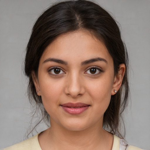 Joyful white young-adult female with medium  brown hair and brown eyes