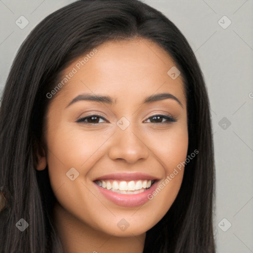 Joyful latino young-adult female with long  brown hair and brown eyes