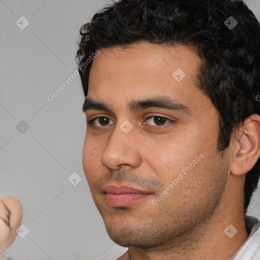 Neutral white young-adult male with short  black hair and brown eyes