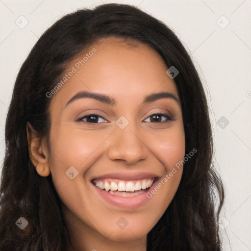 Joyful latino young-adult female with long  brown hair and brown eyes