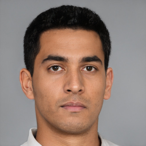 Neutral latino young-adult male with short  black hair and brown eyes