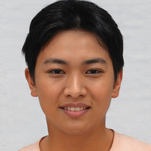 Joyful asian young-adult female with short  black hair and brown eyes