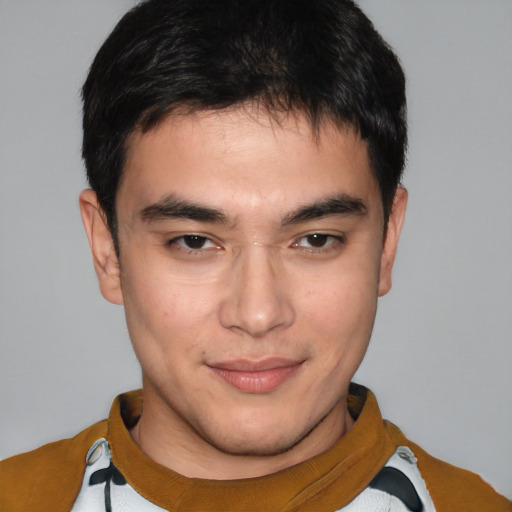 Joyful asian young-adult male with short  brown hair and brown eyes