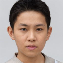 Neutral asian child male with short  brown hair and brown eyes