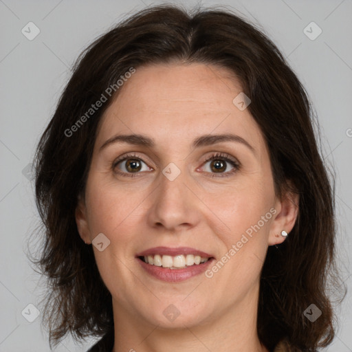 Joyful white adult female with medium  brown hair and brown eyes