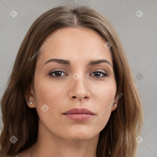 Neutral white young-adult female with long  brown hair and brown eyes