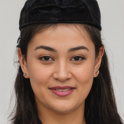 Joyful asian young-adult female with long  brown hair and brown eyes