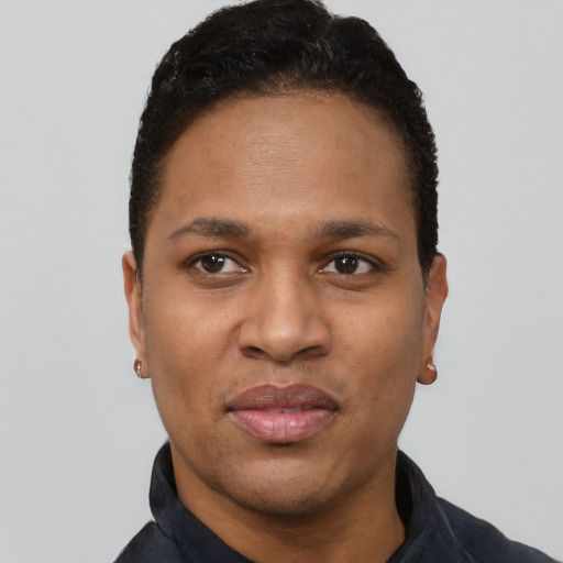 Joyful black young-adult male with short  black hair and brown eyes