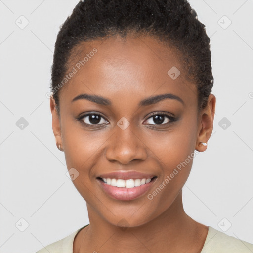 Joyful black young-adult female with short  brown hair and brown eyes