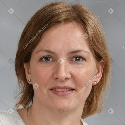 Joyful white adult female with medium  brown hair and blue eyes