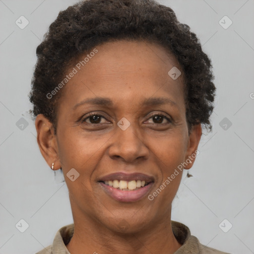 Joyful black adult female with short  brown hair and brown eyes