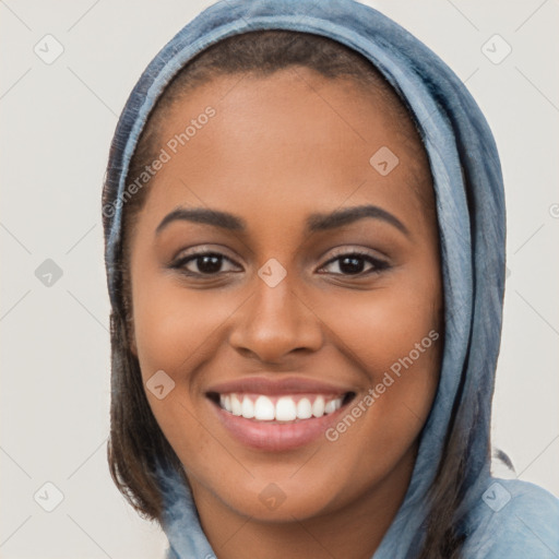 Joyful latino young-adult female with long  brown hair and brown eyes