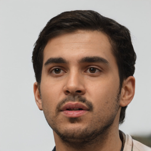 Neutral white young-adult male with short  black hair and brown eyes