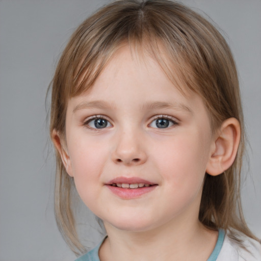 Joyful white child female with medium  brown hair and blue eyes