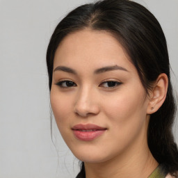 Joyful asian young-adult female with medium  brown hair and brown eyes