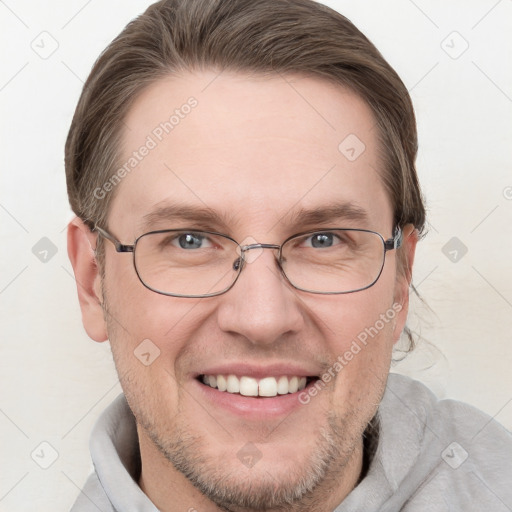 Joyful white adult male with short  brown hair and grey eyes