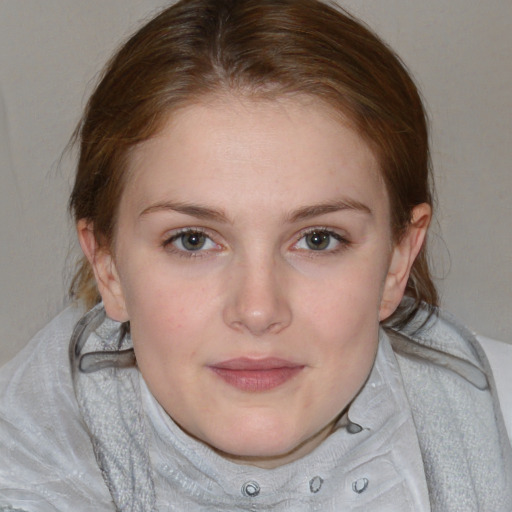 Joyful white young-adult female with medium  brown hair and blue eyes