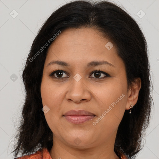 Joyful latino adult female with medium  brown hair and brown eyes