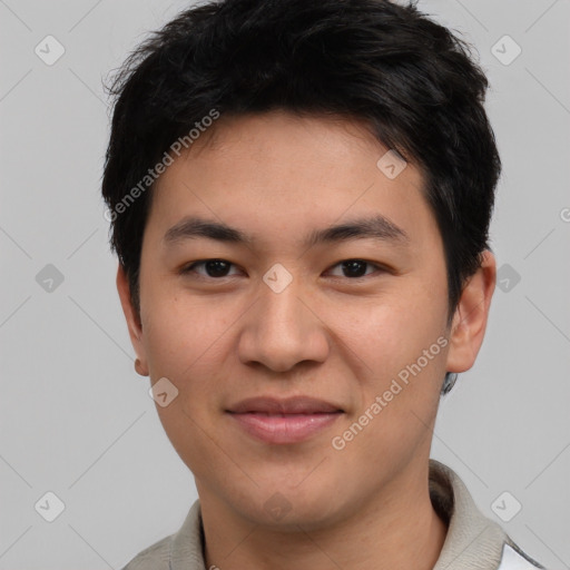 Joyful asian young-adult male with short  brown hair and brown eyes