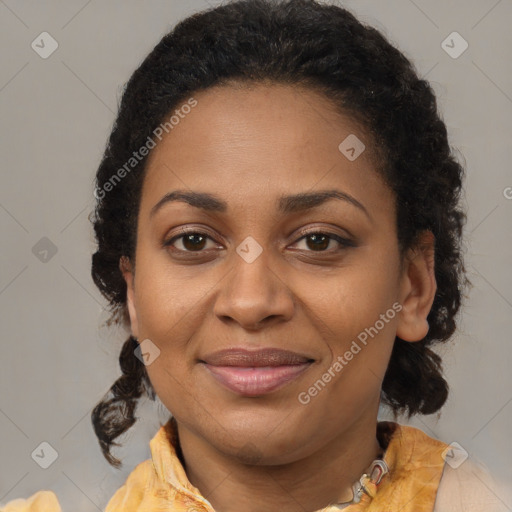 Joyful black adult female with medium  brown hair and brown eyes