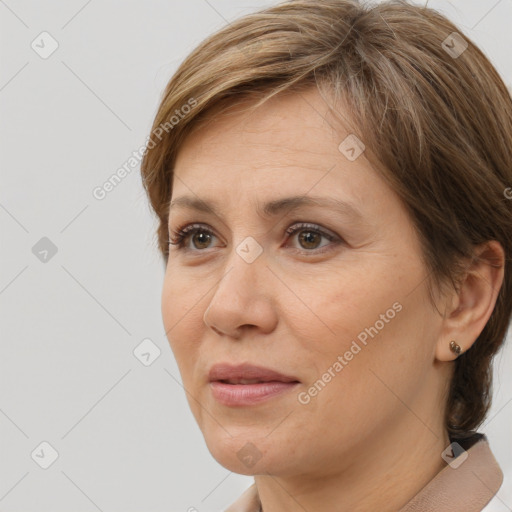 Joyful white adult female with medium  brown hair and brown eyes