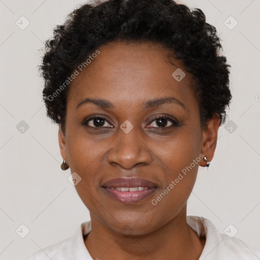 Joyful black adult female with short  brown hair and brown eyes