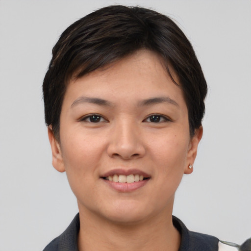 Joyful asian young-adult female with short  brown hair and brown eyes