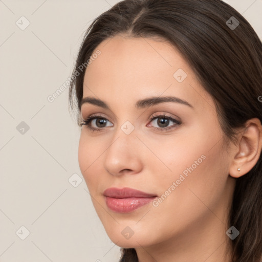 Neutral white young-adult female with long  brown hair and brown eyes