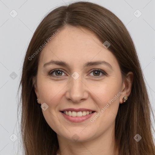 Joyful white young-adult female with long  brown hair and brown eyes