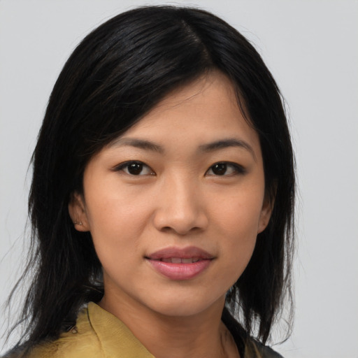 Joyful asian young-adult female with medium  black hair and brown eyes