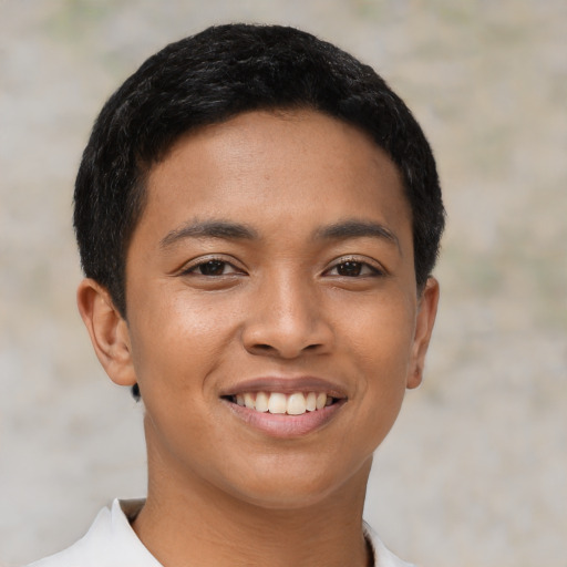 Joyful asian young-adult female with short  black hair and brown eyes