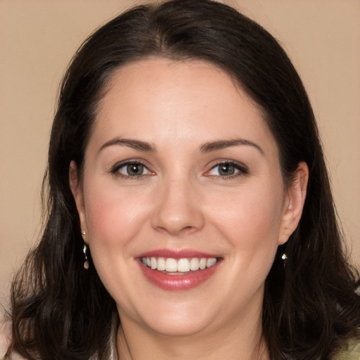 Joyful white young-adult female with long  brown hair and brown eyes