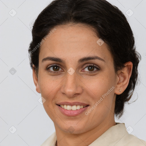 Joyful white adult female with medium  brown hair and brown eyes