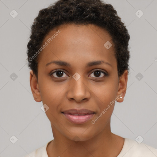 Joyful black young-adult female with short  brown hair and brown eyes