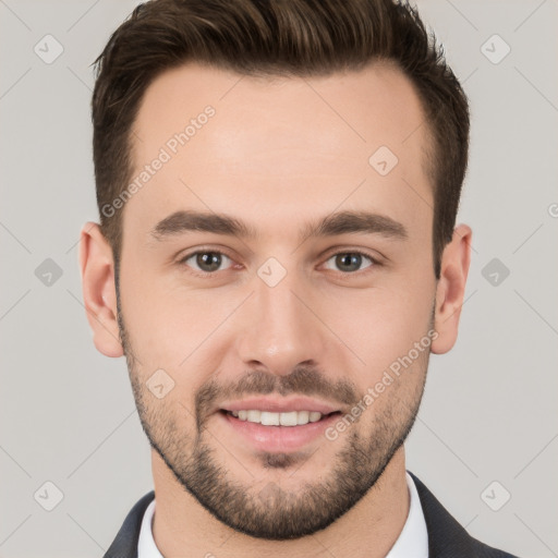 Joyful white young-adult male with short  brown hair and brown eyes