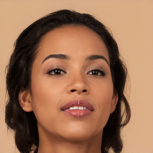 Joyful latino young-adult female with medium  brown hair and brown eyes