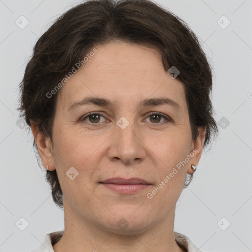 Joyful white adult female with short  brown hair and brown eyes