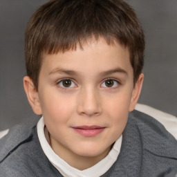 Joyful white child male with short  brown hair and brown eyes