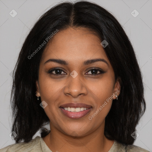 Joyful black young-adult female with long  black hair and brown eyes