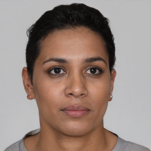 Neutral latino young-adult female with short  black hair and brown eyes