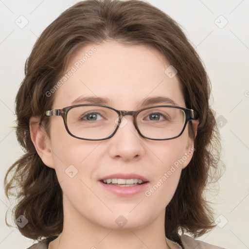 Joyful white young-adult female with medium  brown hair and blue eyes