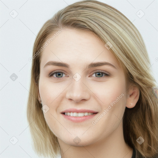 Joyful white young-adult female with long  brown hair and blue eyes